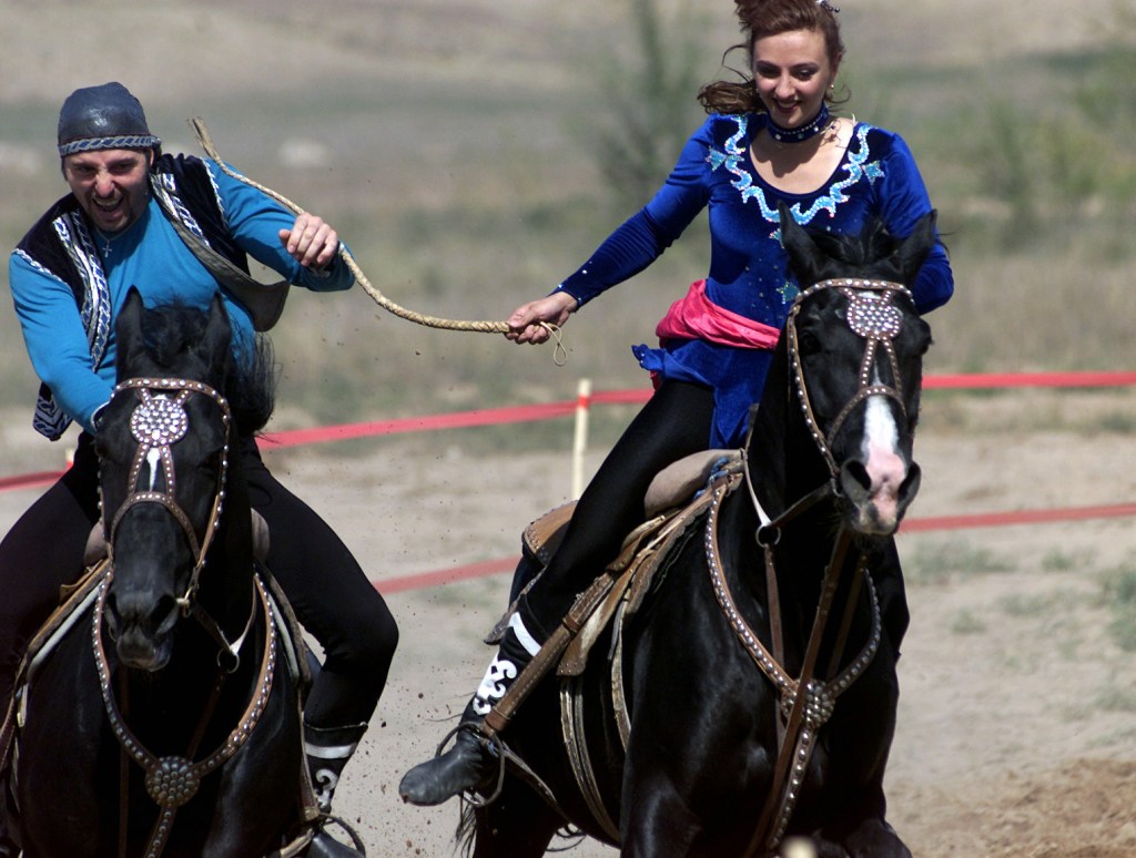 Two kyz kuu horse-riders
